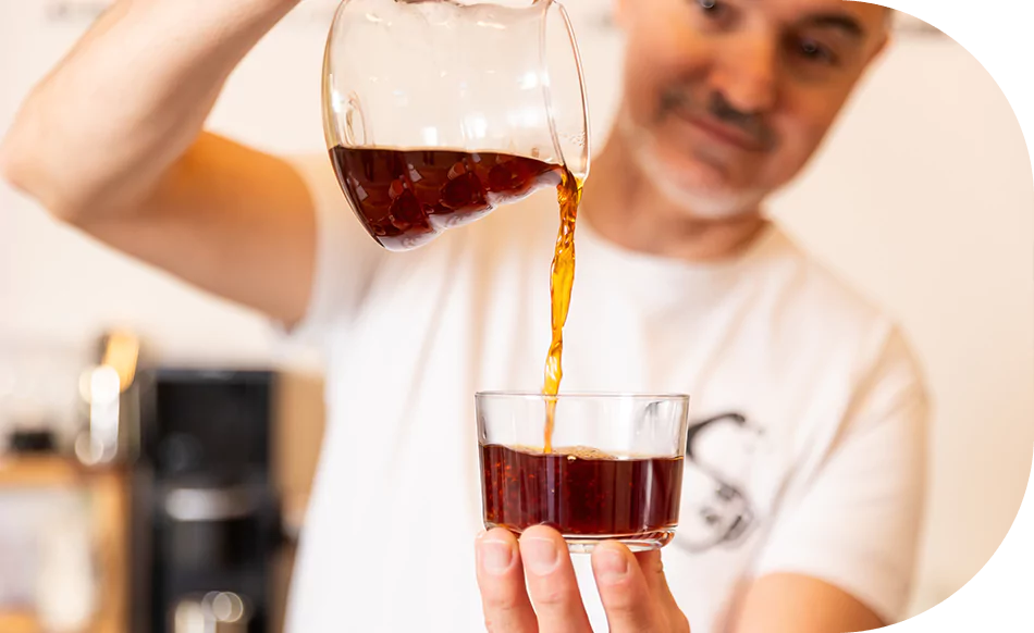 About Us 1 TGCS Pouring Coffee 950x582 1